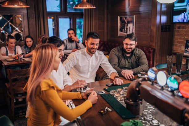 istock Friends sitting at the bar 1181599439