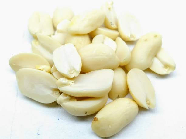 istock A picture of split Peanuts isolated on a white background 1181600275