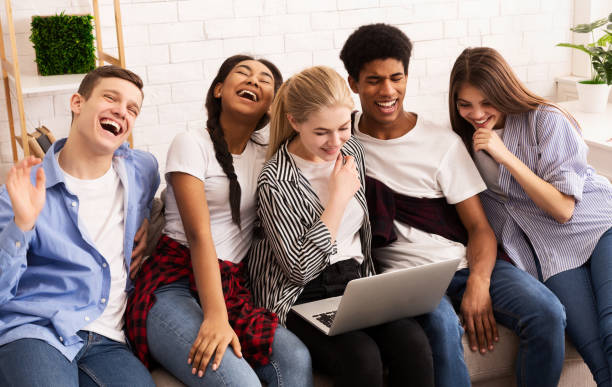 istock Laughing teenagers watching funny content on laptop 1181603654