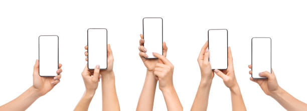 manos de mujer usando teléfono inteligente con pantalla en blanco sobre fondo blanco - hand holding phone fotografías e imágenes de stock