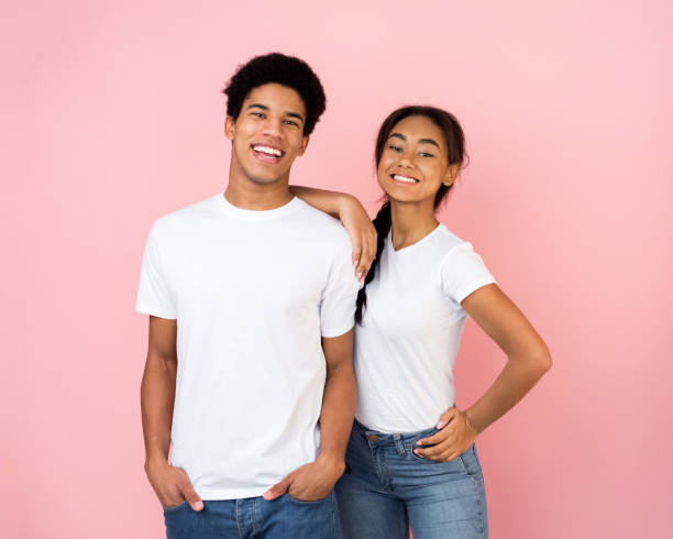 istock Excited afro couple posing on pink studio background 1181604683