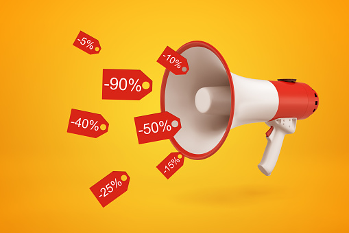 3d close-up rendering of red and white megaphone emitting red discount tags that promise huge price reduction on amber background. Season sales. Boxing Day. Attracting customers.