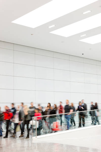 istock Large Group of People Walking Indoors, Social Issues 1181607148