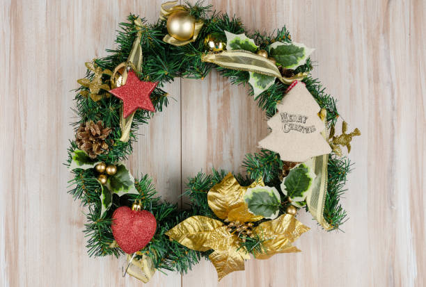 istock Christmas Wreath with Rustic Wood Background 1181607664