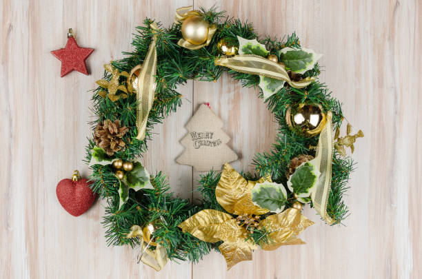 istock Christmas Wreath with Rustic Wood Background 1181607669