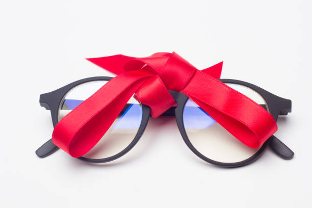 istock glasses and gift ribbon 1181607972