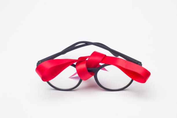 istock glasses and gift ribbon 1181607974