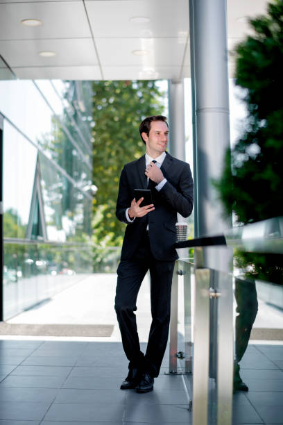 istock Businessman on trip using tablet at the airport 1181608698
