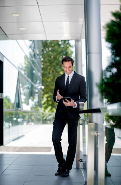 istock Businessman on trip using tablet at the airport 1181608786