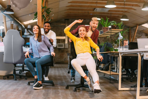 istock Time for break. Joyful colleagues having fun at workplace 1181608861