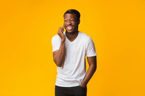 istock Afro Man Talking On Phone Laughing Standing In Studio 1181609213
