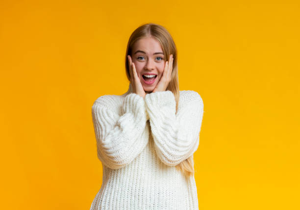 istock Surprised stunned emotional girl with hands on cheeks 1181610806