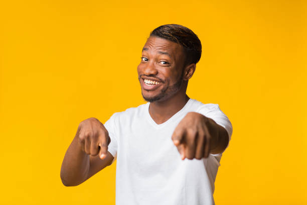istock Positive African American Man Pointing Fingers At Camera, Studio Shot 1181611231