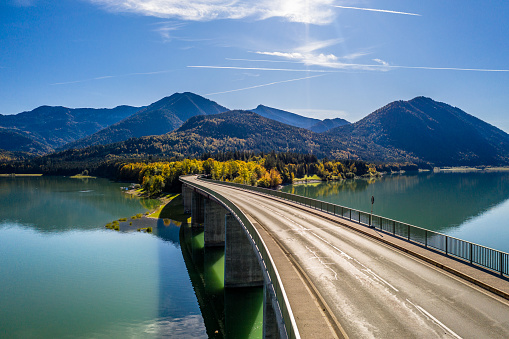 Lake Sylvenstein in Bavaria. Alps Mountains in autumn and beautiful colour of the water. Bridge over Reservoir