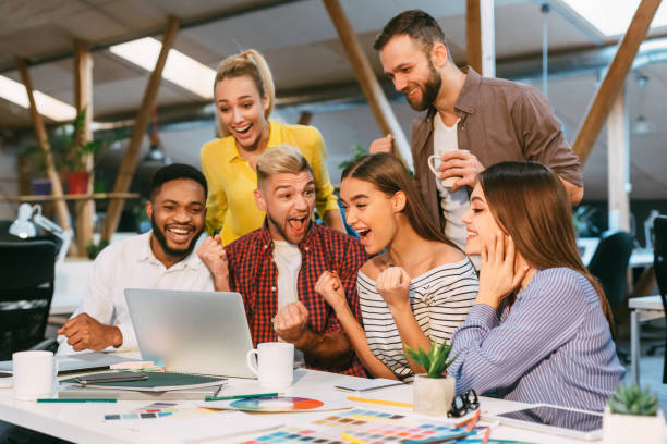 istock Happy designers celebrate successful project realization in office 1181613046