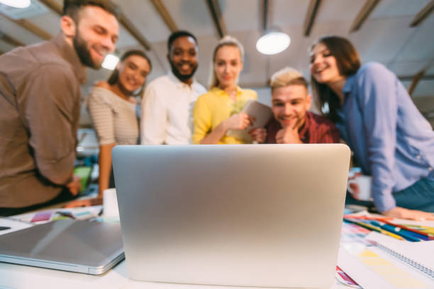 istock IT designers brainstorming, discussing new ideas on laptop 1181613118