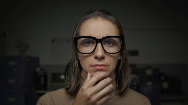 istock Puzzled woman thinking with hand on chin 1181613138