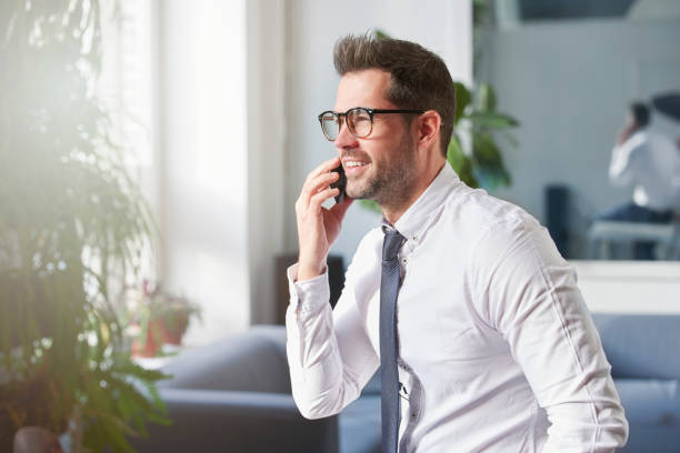 istock Businessman making a call while sitting in the office 1181613265