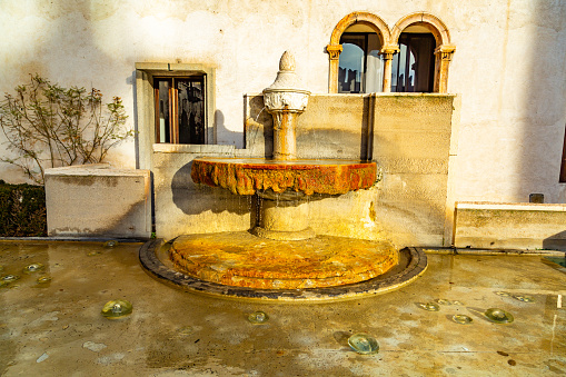 Verona,Veneto,Italy  6 january 2014:A particular fountain in the courtyard at Castelvecchio Museum  in Verona, Italy.