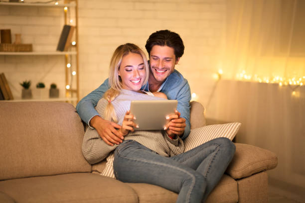 istock Happy young couple using tablet and enjoying time 1181618315