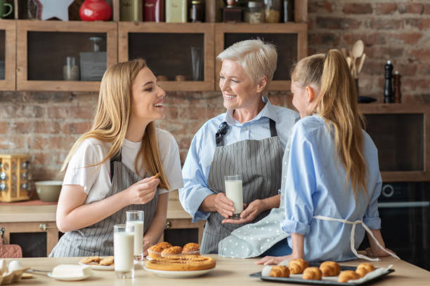 istock Positive women having snack after cooking in kitchen 1181619237