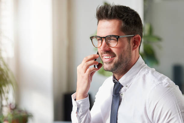 istock Businessman making a call while sitting in the office 1181619799
