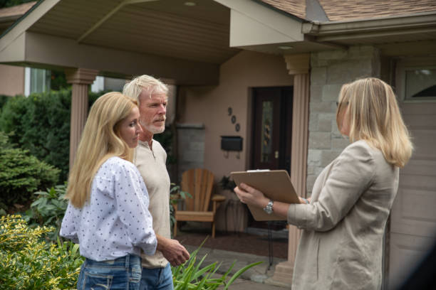 istock Couple Looking at a New House 1181619906