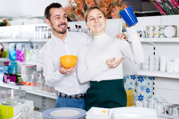 istock Couple picks out  ceramic  crockery 1181622537