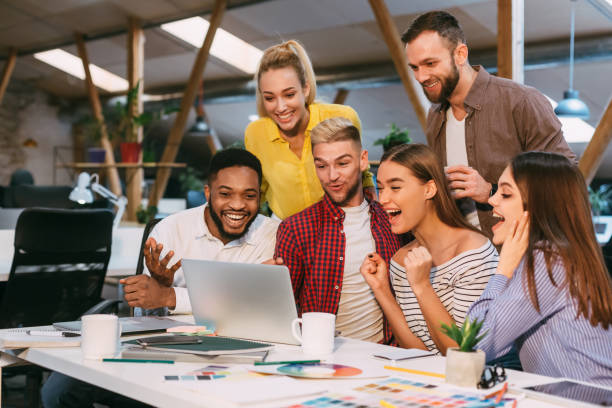 istock Lucky corporate team. Designers celebrate successful project 1181622937