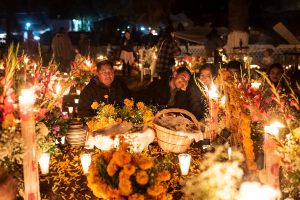 Celebration of Mexican Day of the Dead at Tzintzuntzan Cemetery in the Pátzcuaro Region of Michoacán State. stock photo