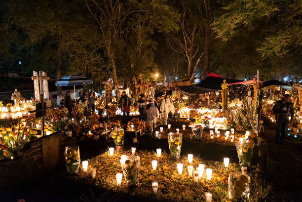 Celebration of Mexican Day of the Dead at Tzintzuntzan Cemetery in the Pátzcuaro Region of Michoacán State. stock photo
