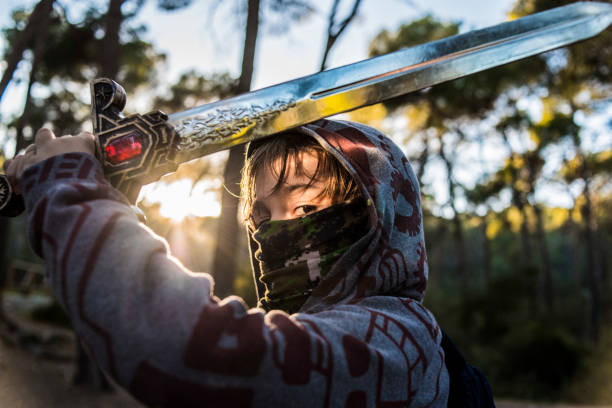 istock Warrior boy fighting on the mountain 1181634919