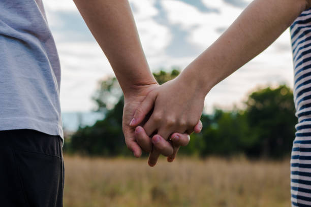 istock A lesbian couple holding her hands 1181637220