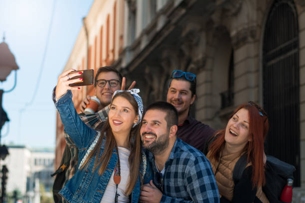 istock Happy multiracial friends group taking selfie 1181637347