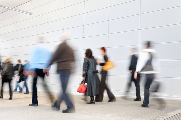 istock Businesspeople Walking Through White Hallway 1181637490