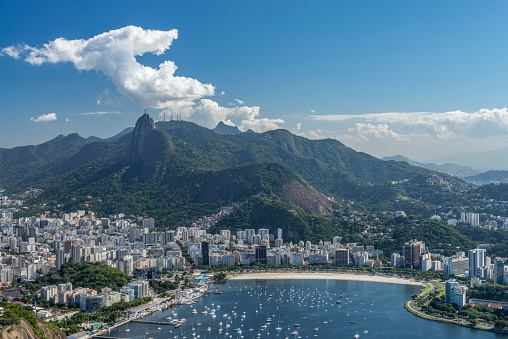Aerial view of the Botafogo district, beach, water bay and cityscape from the Sugarloaf mountain at Rio de Janeiro city, Brazil.