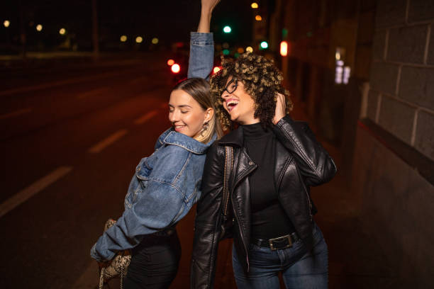 istock Cheerful  friends enjoying the night out 1181640029