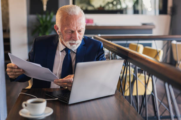 istock Senior businessman reading a contract 1181645603