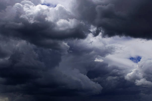 istock Dark sky, white fluffy and rainy dark clouds before rain. 1181647099