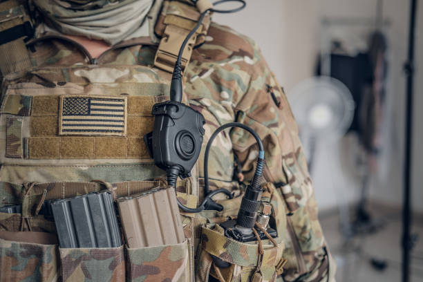 Military man with radio in pocket stock photo