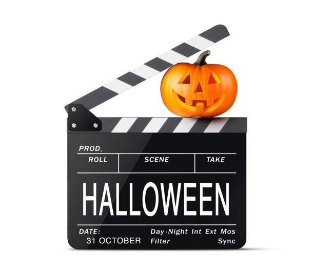 istock Halloween Ciak. Movie clapper board with Jack O'Lantern. 1181647616