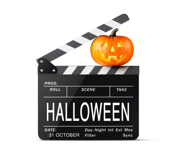 istock Halloween Ciak. Movie clapper board with Jack O'Lantern. 1181648133