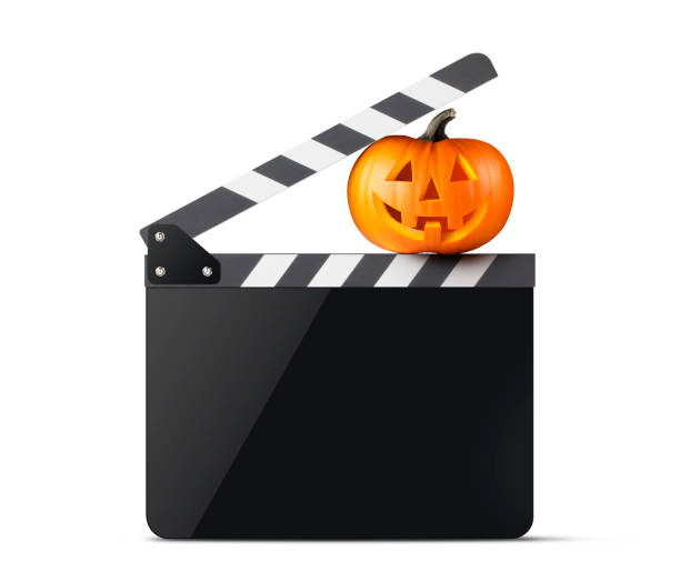 istock Halloween Ciak. Movie clapper board with Jack O'Lantern. 1181648740