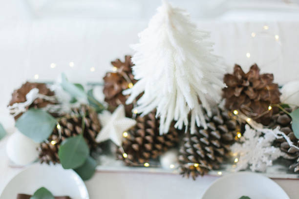 istock White and brown Christmas table decorations with eucalyptus leaves 1181650217