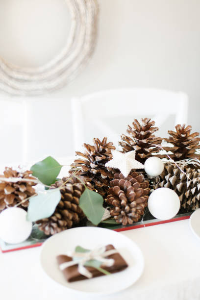 istock Modern white and brown Christmas winter decorations with rustic wreath 1181650381