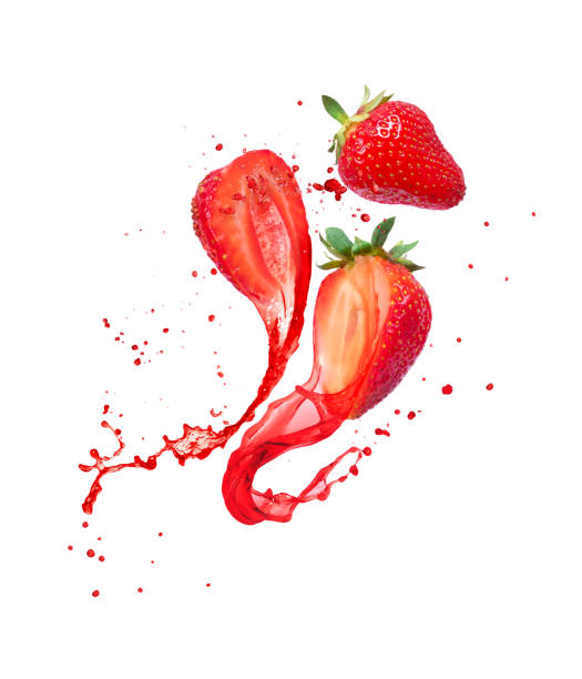 istock Juice splashes out from cutted strawberries on a white background 1181650535