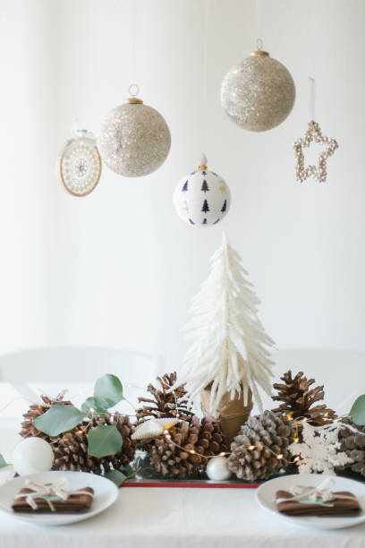 istock White and brown Christmas table decorations with eucalyptus leaves 1181651322