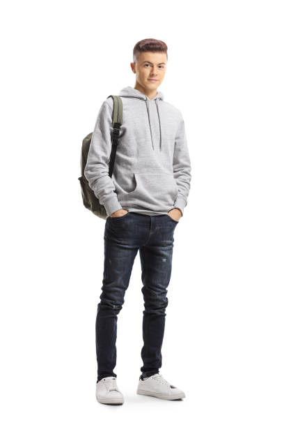 istock Teenage schoolboy posing with hands in pockets 1181652932