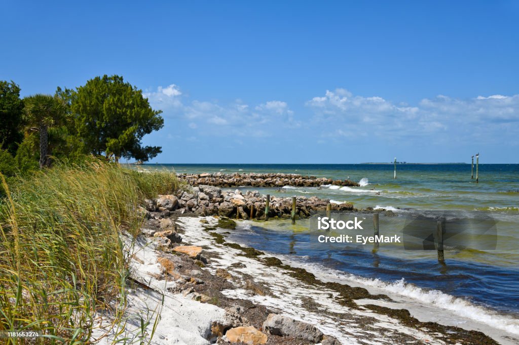 Stone Jetties on Island Stone Jetties on Anna Maria Island to minimize beach erosion from rising tides in Tampa Bay Florida - US State Stock Photo