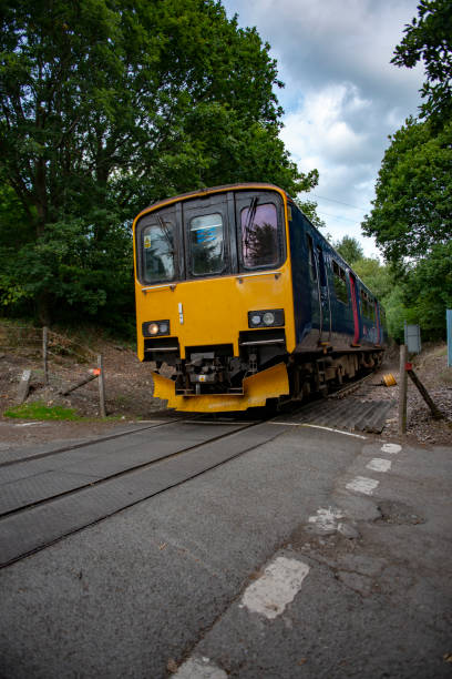 Railway train approaching an unmanned level crossing